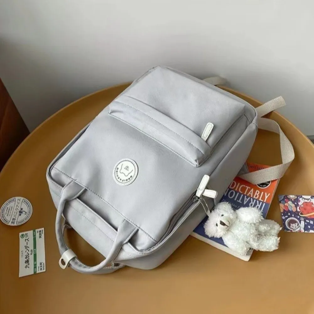 Solid Large Capacity Student Backpack Nylon Multi-Pocket Academy Girl's School Bag Zipper Spacious Pendant Teens Rucksack