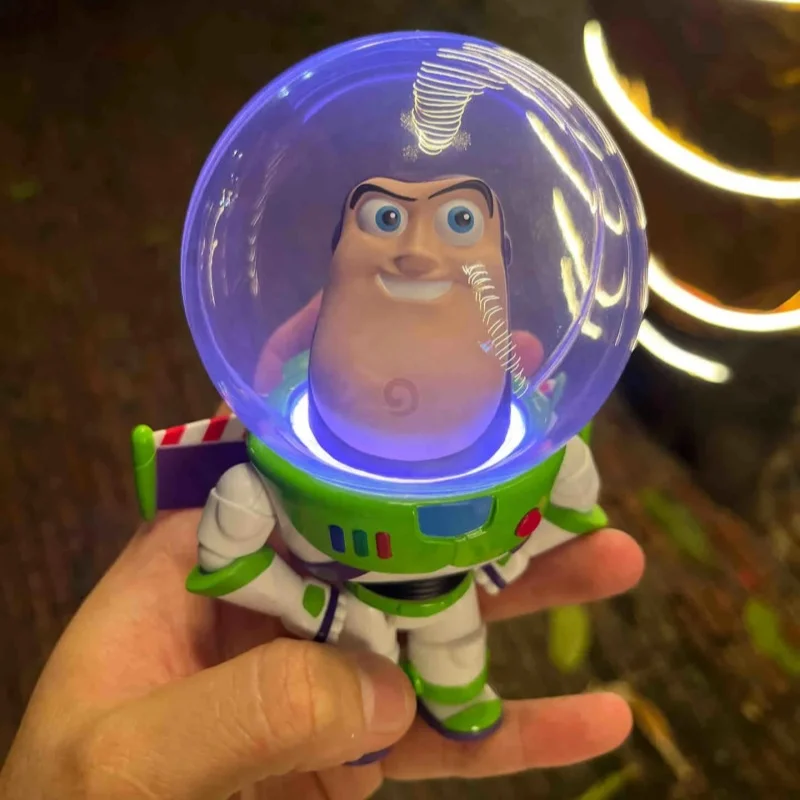 

Original Toy Story Buzz Lightyear Wireless Charger Roadblock Ligh Bubble Head Trendy Toy Light Game Console Speaker Toys Model