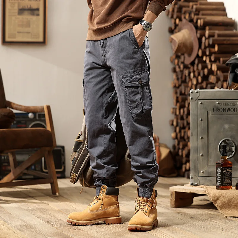 Celana Jogger Multi Saku Warna Solid Trendi Kasual Dasar Pria High Street Fashion Amerika Celana Kargo Pria Pakaian 2025