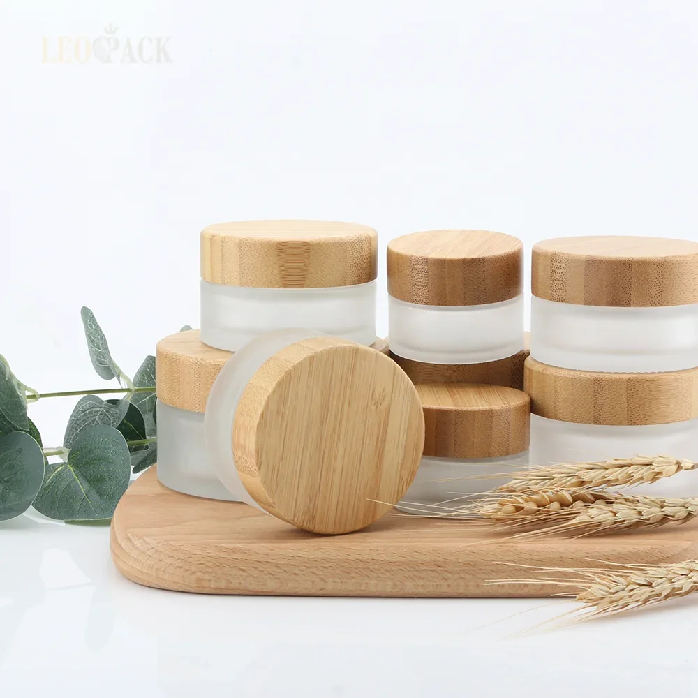 

clear frosted glass cream jars cosmetic packaging with Bamboo Lids with Plastic Screw Inner Cap Cream Jar with Wood Grain Cover