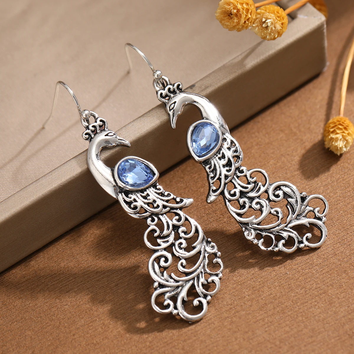 Bohemian style hollowed-out peacock inlaid with artificial gemstones drop earrings for ladies, suitable for daily formal wear.