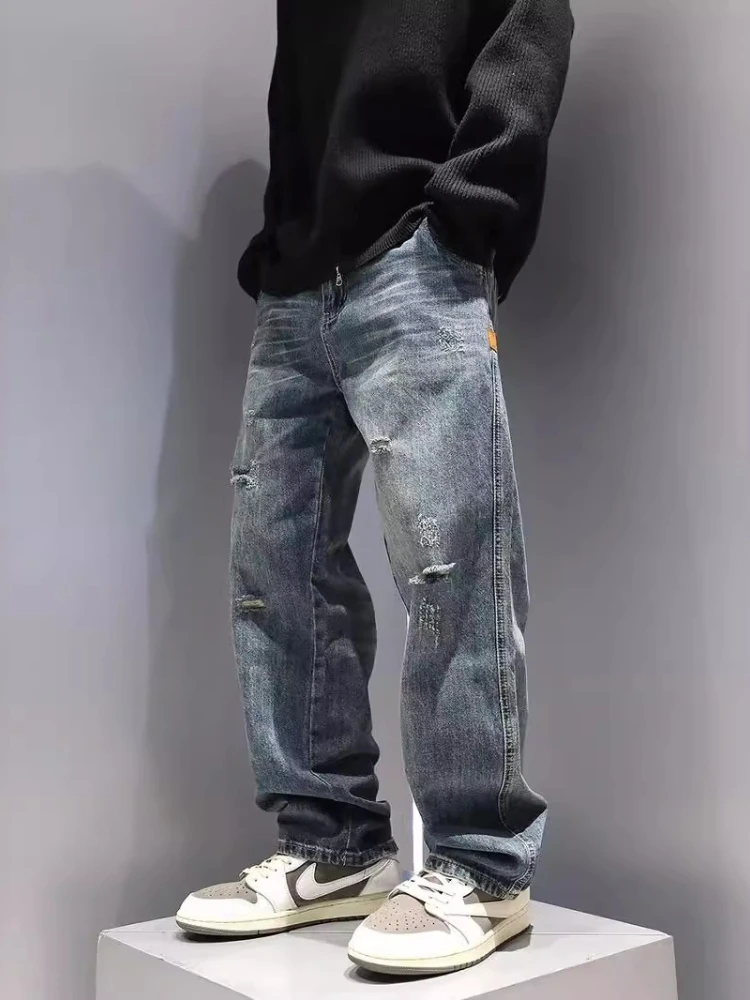 Nowe męskie porwane dżinsy luźne proste moda Vintage niebieskie spodnie dżinsowe osobowość Streetwear Hip Hop wysokiej jakości męskie spodnie