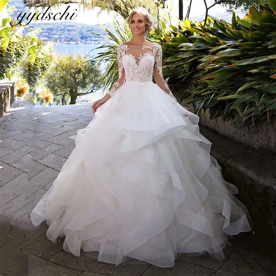 

Elegant O-Neck Backless Appliques Tulle Cut-out Tiered Full Sleeves Wedding Dresses 2024 Court Train Ball Gown Bridal Gown