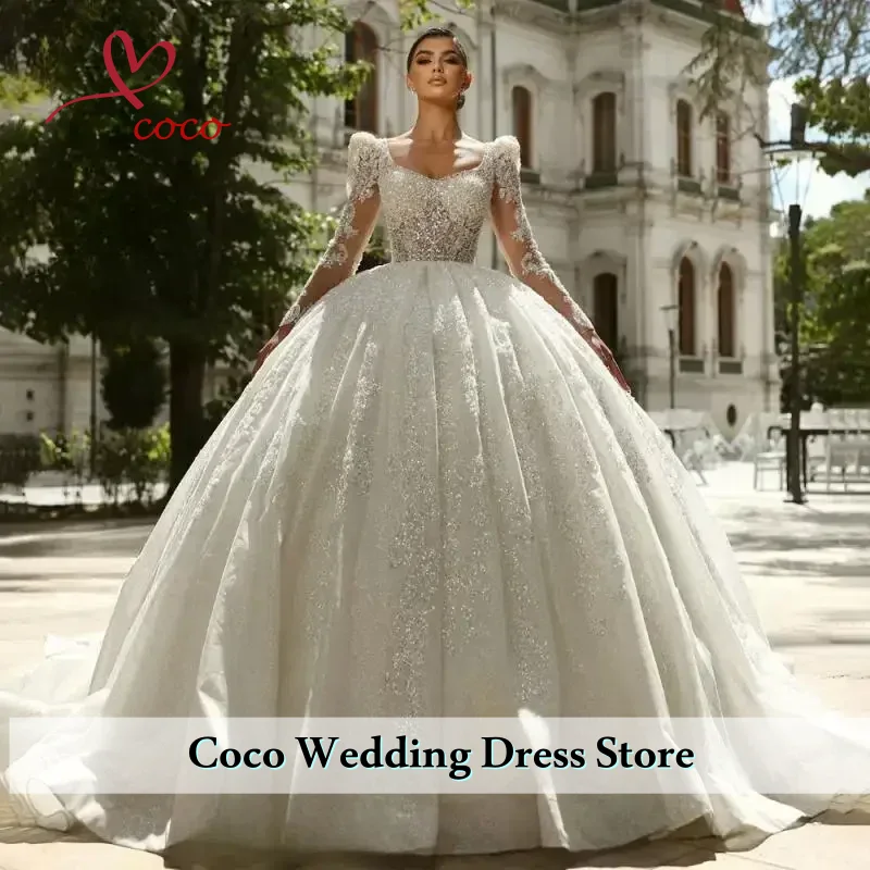 فساتين زفاف فاخرة مخصصة سباركلي على شكل كرة على شكل قلب وأكمام طويلة مزينة بالخرز من الدانتيل فساتين زفاف فيستدوس دي نوفيا