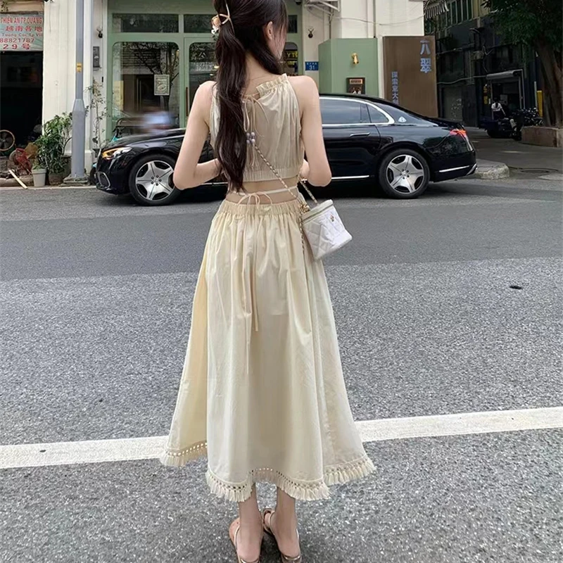 Fashion and Casual Summer Halter Hollow Sleeveless Tassel Solid Color Simple and Generous Hem Holiday Beach Women\'s Long Dress