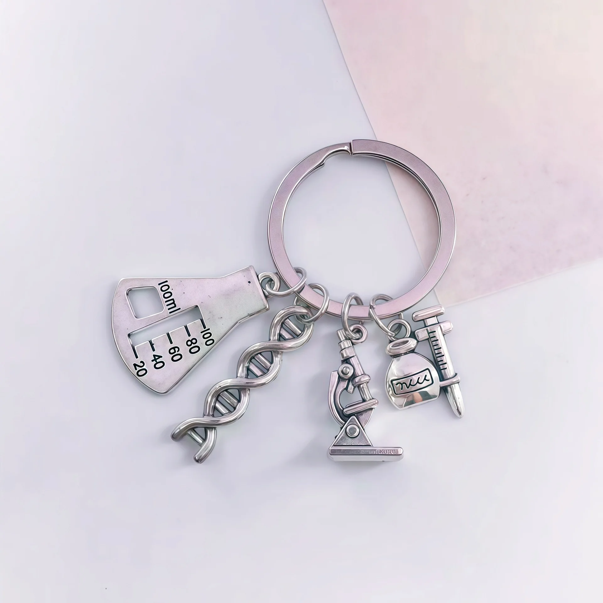 Creative design of experimental tool combination: practical daily keychain featuring DNA, flask, and microscope accessories