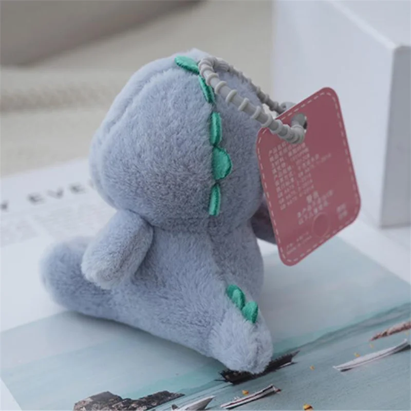 Peluche de dinosaure en forme d'animal de dessin animé, jouet de beurre, pendentif, sac à dos, tentures, ornements, cadeaux