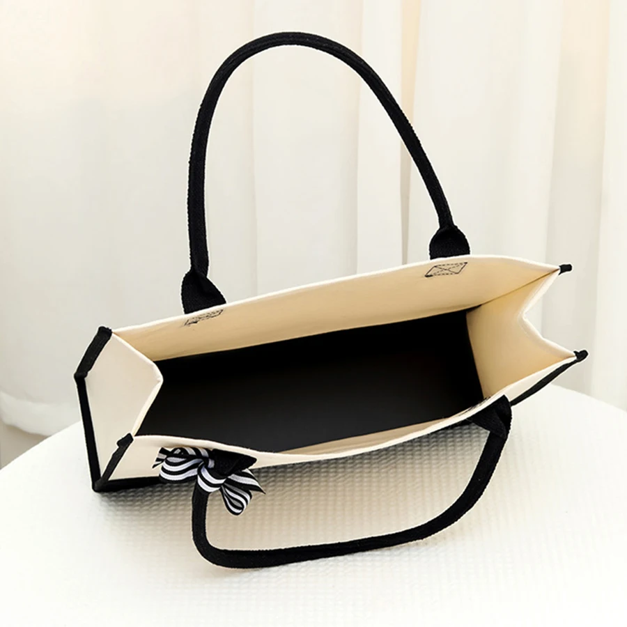 حقيبة يد جلدية مطبوعة بأحرف، حقيبة حمل رجالية ذات سعة كبيرة، حقيبة حمل عصرية متعددة الوظائف.