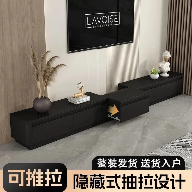 The new hidden pull-out slate TV cabinet floor-to-ceiling coffee table solid wood floor cabinet is simple and modern for small