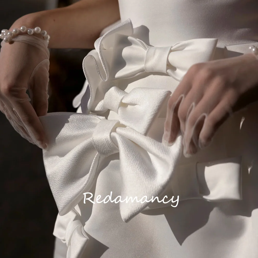 Redamancy-vestido de novia blanco sin tirantes, traje Sexy de satén con lazo, corte en A, Espalda descubierta, ajustado hasta la rodilla, para fiesta, 2024