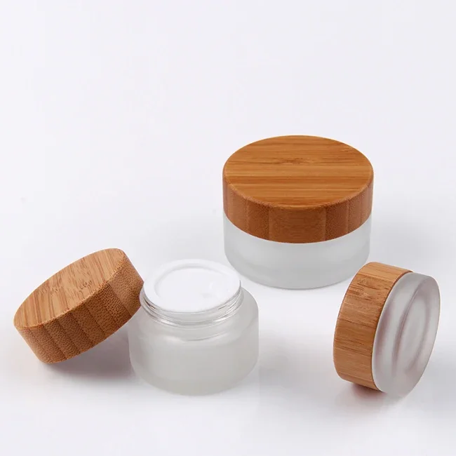 

hot sale high quality Refillable Frosted Clear Glass Cosmetic Jars bamboo lid Empty Face Cream Lip Balm with bamboo wood caps