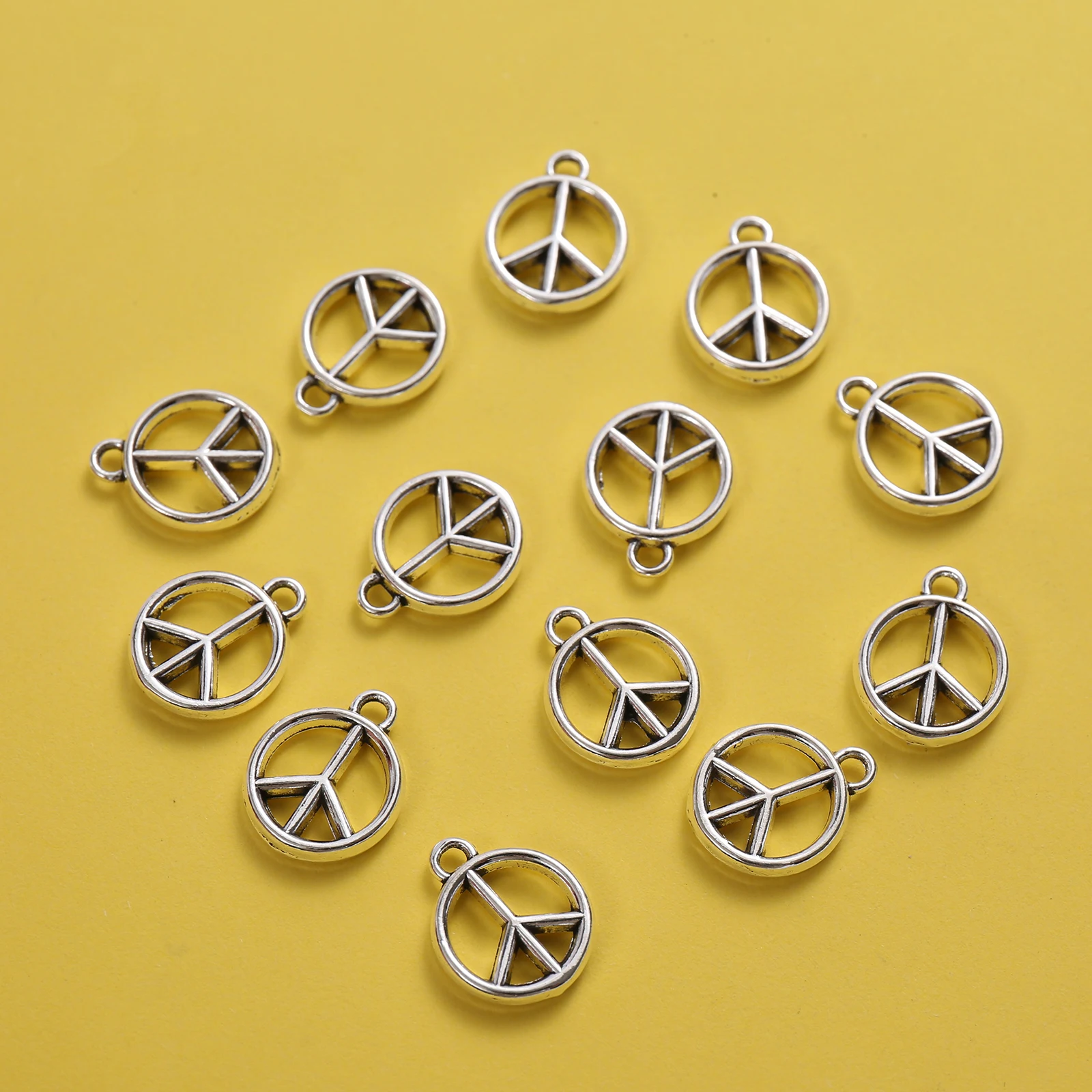 20 Pieces of Vintage-Style Hollow Peace Symbol Pendants, Logo-Shaped, with Built-In Hanging Loops, Suitable for DIY Bracelets, Earrings, Necklaces, Niche Trendy Handmade Beading Accessories