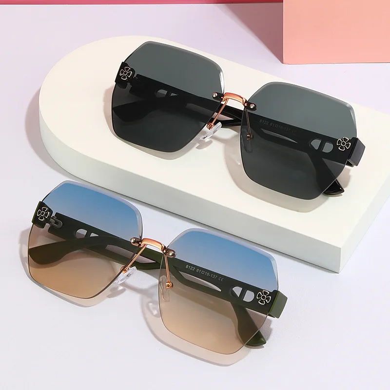 Polygonal frameless metal middle beam sunglasses high-end four-leaf clover hollow trimmed lenses fashion sunglasses