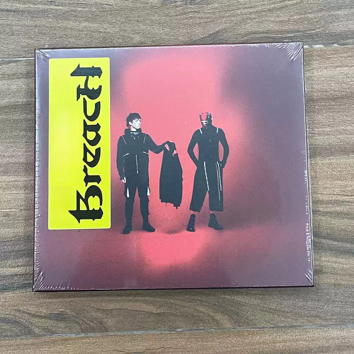 

Alternative Electronic Rock CD Red-Toned Background Dual Silhouette Cover Dark Pop Experimental Collectible Audio Disc