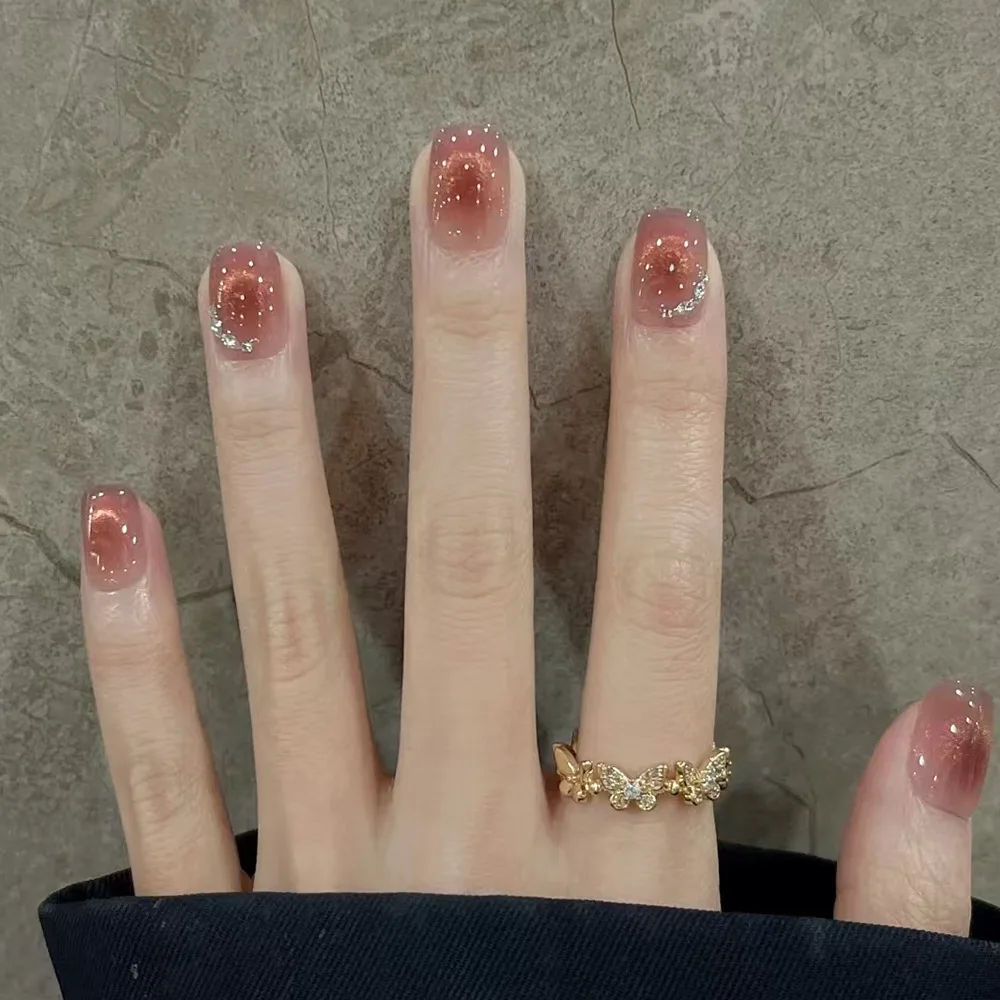 

24pcs Pink Cat Eye Press-On Nails with Delicate Starry Sky & Rhinestone Accents, Short Oval Shape, Assorted Sizes