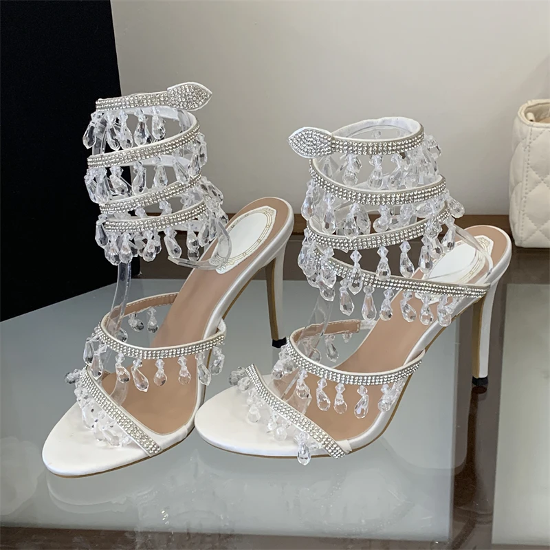 Aneikeh Sommer Elegante Dünne Hohe Absätze Kristall-Diamant-Anhänger Damen Sandalen Glitzer Knöchelriemen Bankett-Schuhe