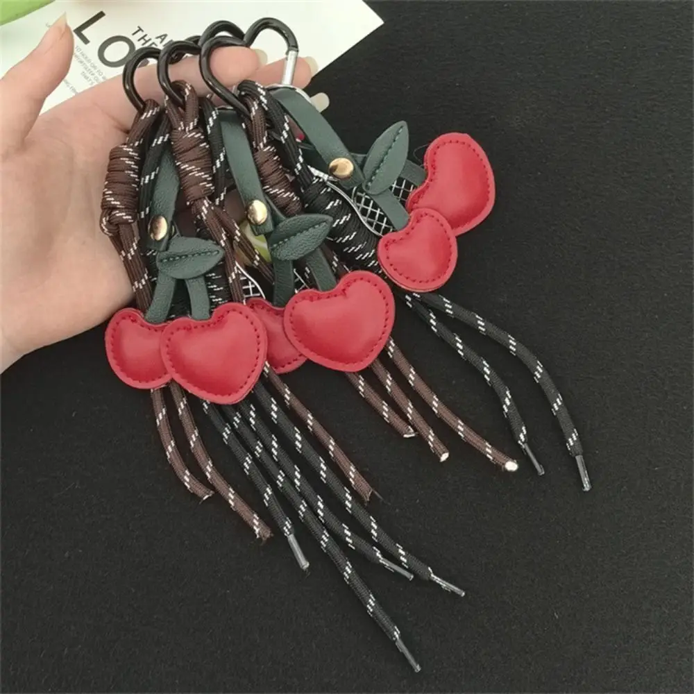 فتاة القلب حبل مضفر المفاتيح المنسوجة يدويا الكرز على شكل حقيبة قلادة مجوهرات مكافحة خسر مضرب تنس مفتاح سلسلة