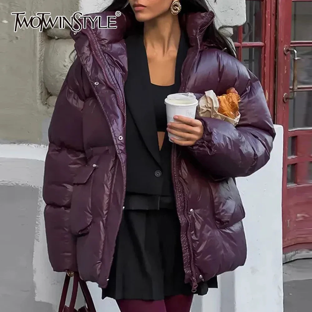 Twotwinstyle sólido emendado bolsos soltos parkas para mulheres com capuz manga longa temperamento casacos estilo de moda feminina