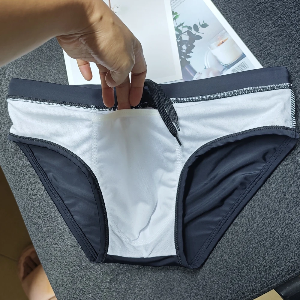 2026Men's pure black rear mesh swimming trunks hollow fashion hot spring shorts nylon swimming trunks 10134-10134zb
