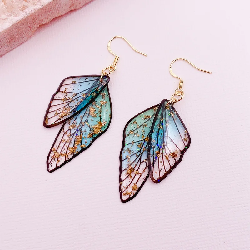 ALLNEWME Fashion Clear Gradient Color Resin Wings Dangle Earrings for Women Wholesale Brass Rhinestone Butterfly Pendant Earring