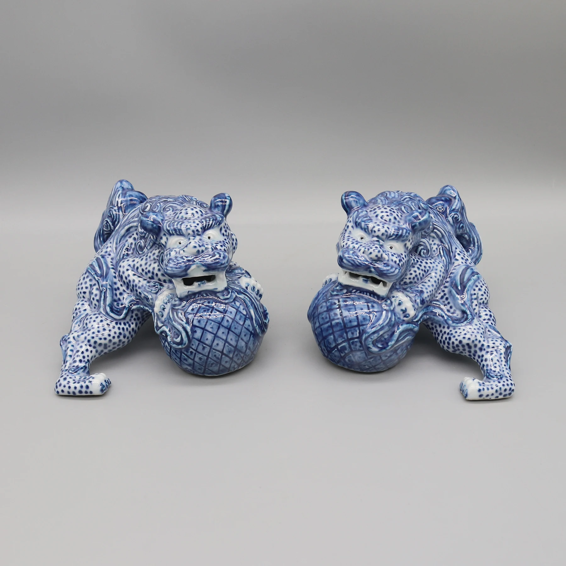 

Guardian Lions Playing with the Balls, Pair of Blue and White Porcelain Figurines, Home Decoration