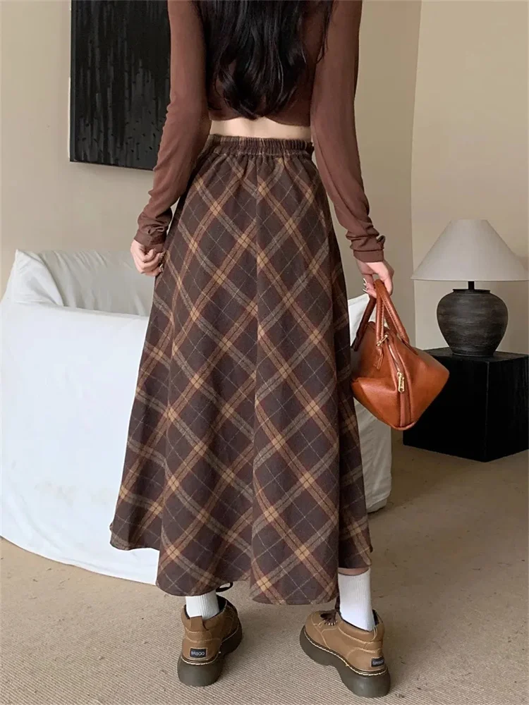تويد منقوشة عالية الخصر نصف الجسم تنورة الإناث الخريف والشتاء جديد ريترو فضفاض ساحات كبيرة الترفيه طويلة ألف خط نصف الجسم تنورة