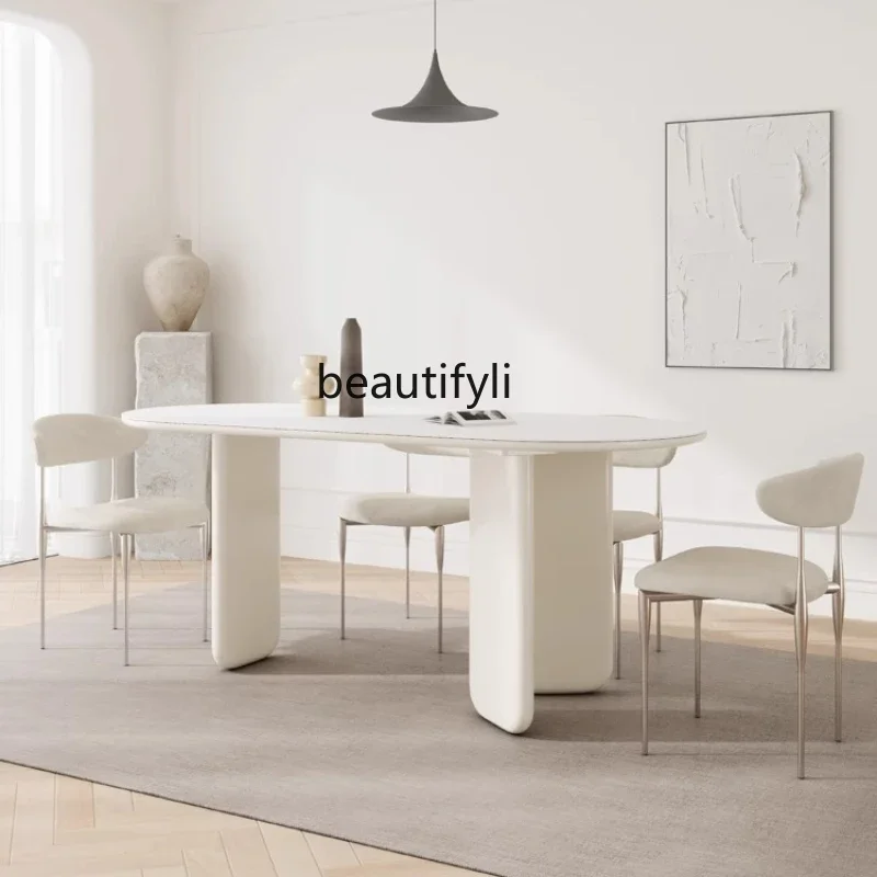 

Cream wind rock slab dining table Small apartment Modern simple household solid wood oval dining table