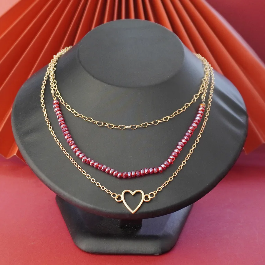 9999 gold stainless steel multi-layer necklace with red glass beads and heart-shaped pendant in gold for women
