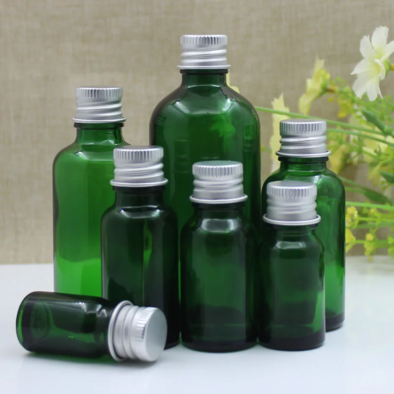 24 pezzi 5 ml 10 ml 15 ml 20 ml 30 ml 50 ml 100 ml Bottiglia di olio essenziale di vetro verde Bottiglia vuota per imballaggio cosmetico Cura personale con coperchio