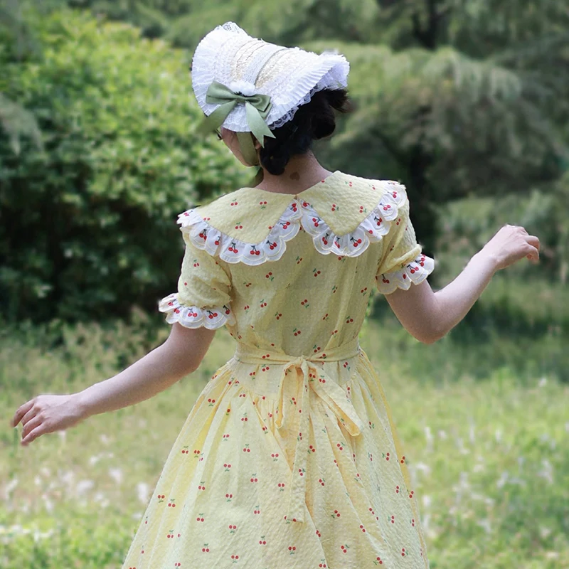 AnXin SH Vintage Prinzessin gelbe Baumwolle Kirschdruck Blumenspitze V-Ausschnitt Kurzarm Knopf Reißverschluss individuelles Abendkleid