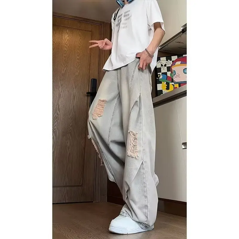 جينز ممزق مغسول باللون الأزرق للرجال صيفي أمريكي عالي الشارع فيبي سروال فضفاض واسع الساق