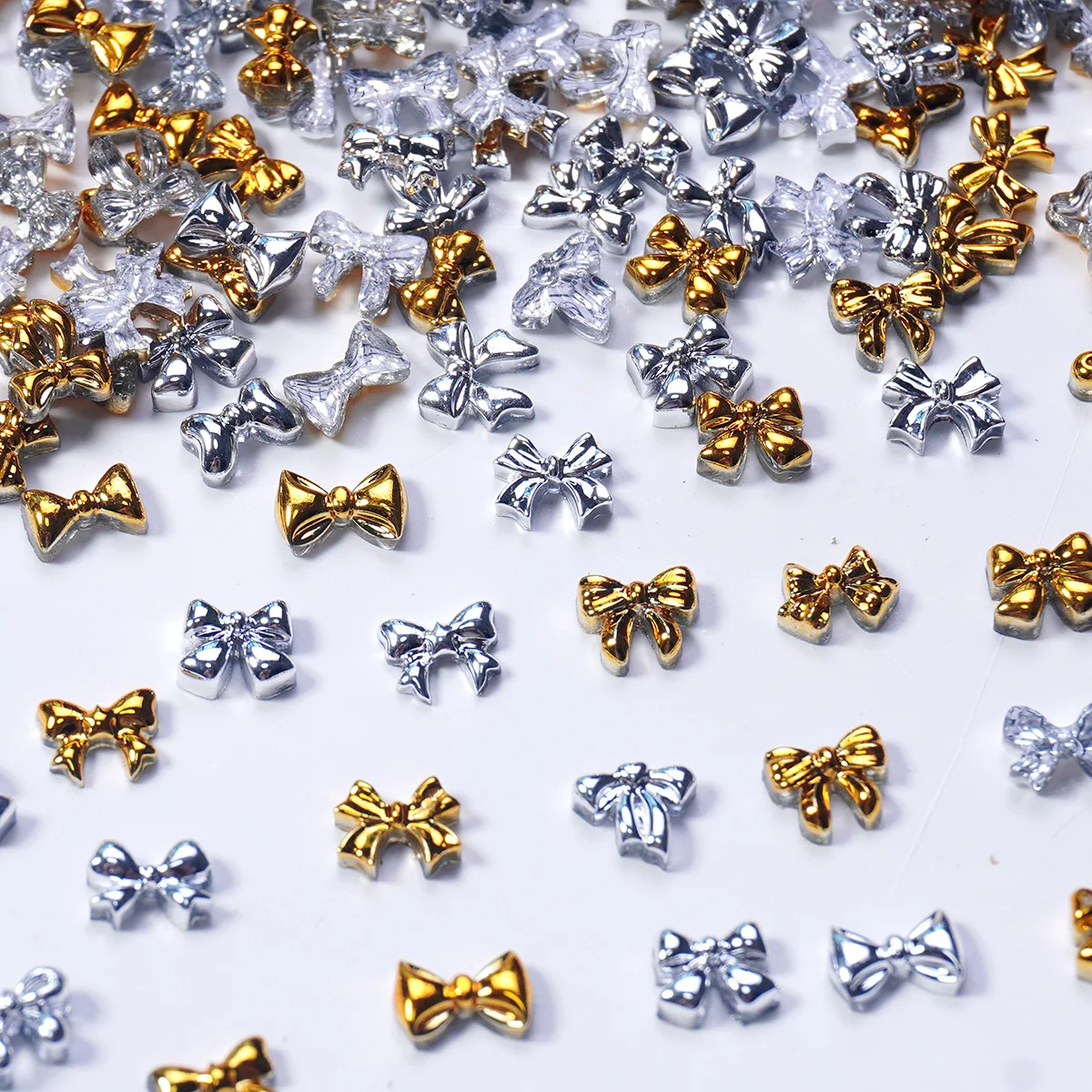 50/100 Uds., Mini lazo, pajarita, accesorios para uñas, diamante de resina, aleación de imitación metálica, accesorios para uñas de cinta