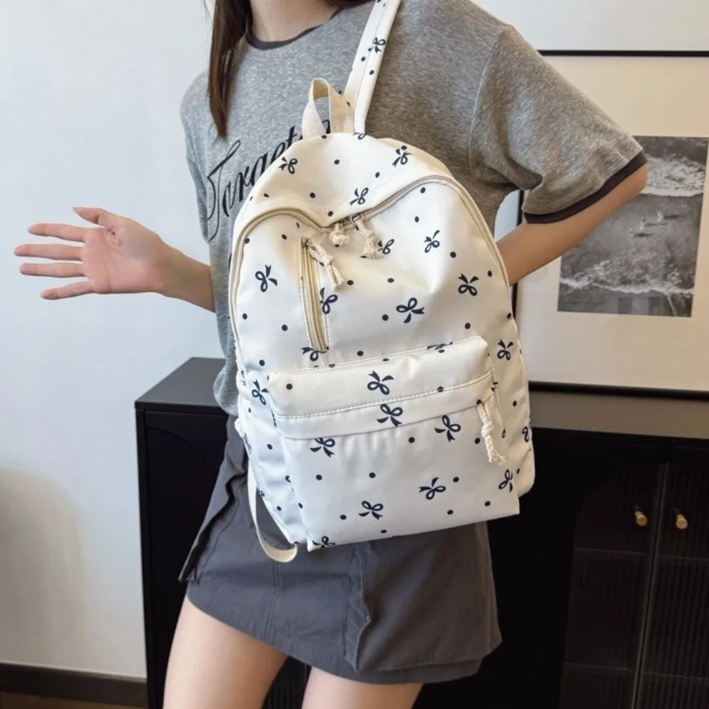 حقيبة ظهر لطيفة متعددة الجيوب مطبوعة على شكل فيونكة ذات سعة كبيرة من النايلون حقائب مدرسية بأشرطة قابلة للتعديل حقيبة كتب للاستخدام اليومي