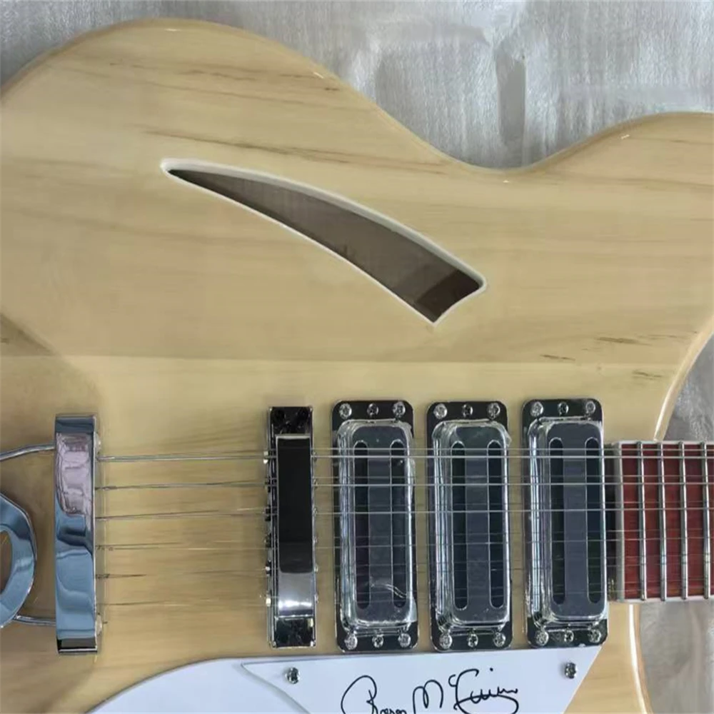 

Half hollow body 12-string electric guitar, in natural wood color, with 3 pickups, available for immediate shipment