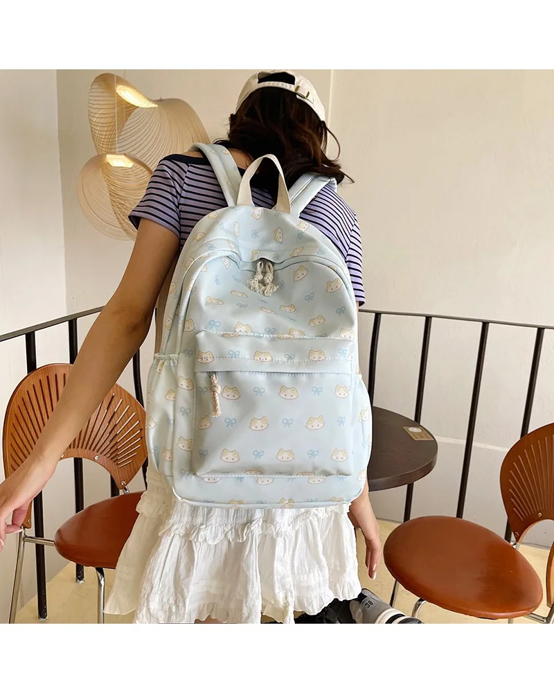 

Cartoon printed kitten lightweight backpack women's large capacity travel backpack small fresh student schoolbag