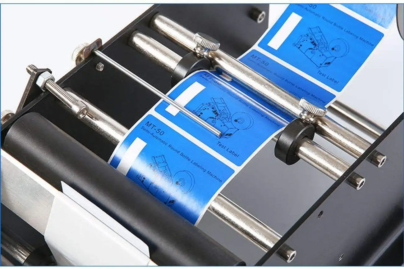 Maszyna do naklejania etykiet ST-76 na okrągłe butelki, wino, plastikowe butelki, mała maszyna pakująca, ręczna maszyna do etykietowania.