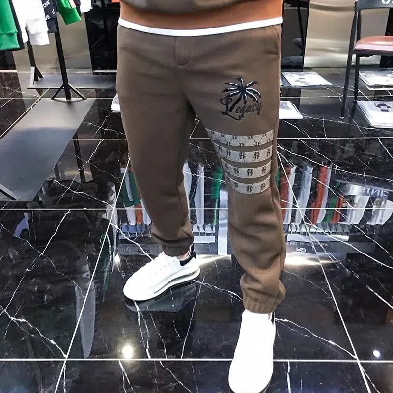 Autunno e inverno nuovo ricamo cuciture felpa con cappuccio abbigliamento uomo tendenza moda manica lunga t-shirt pantaloni tuta sportiva da corsa