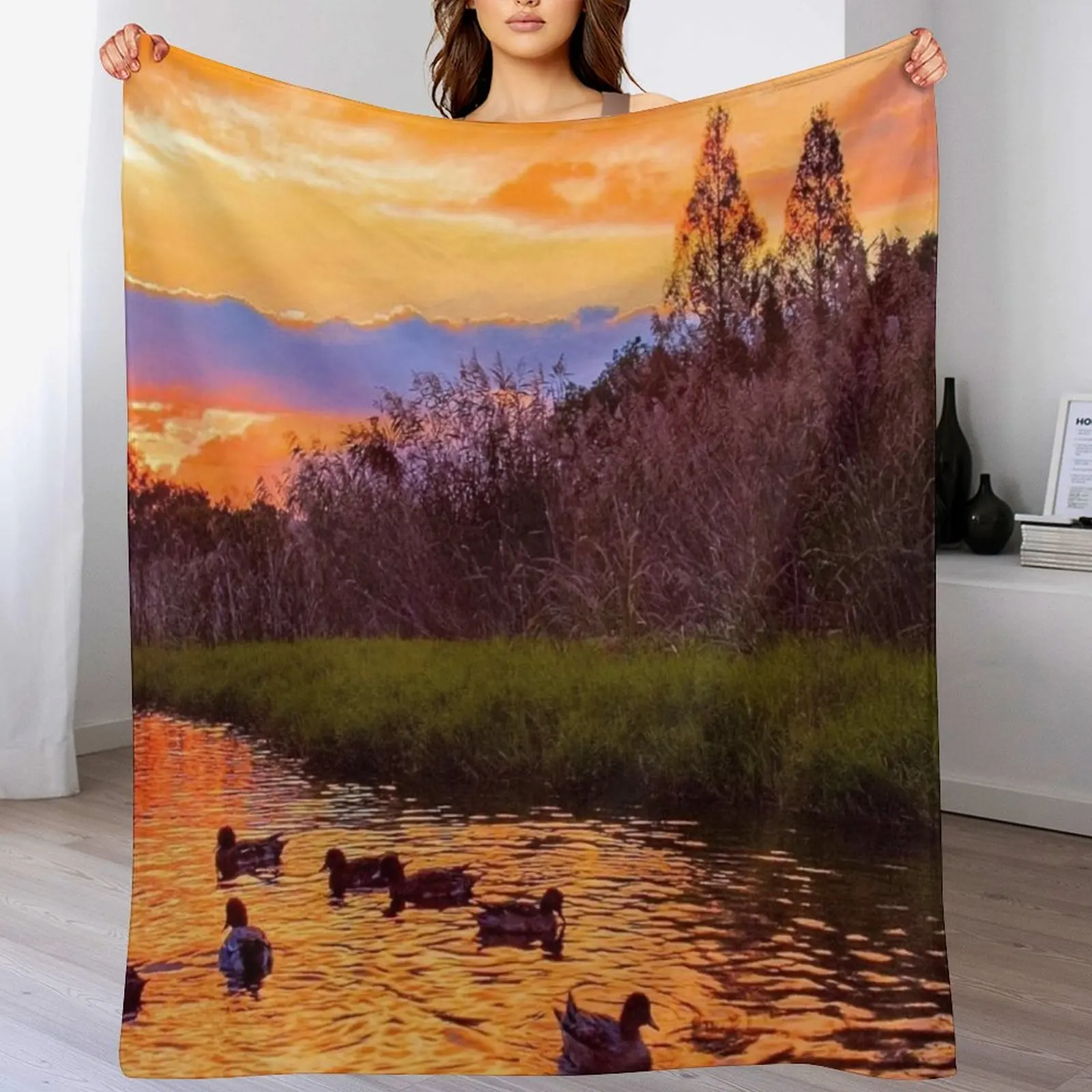 

Sunset over the water Throw Blanket