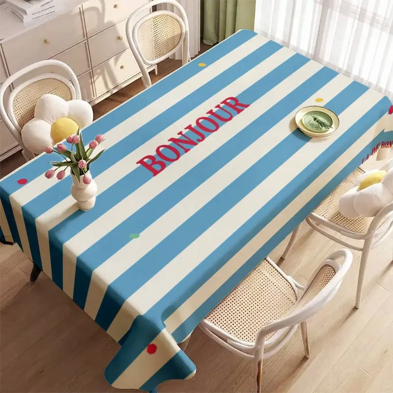 A soft, fashionable and attractive blue and white striped tablecloth with the slogan 