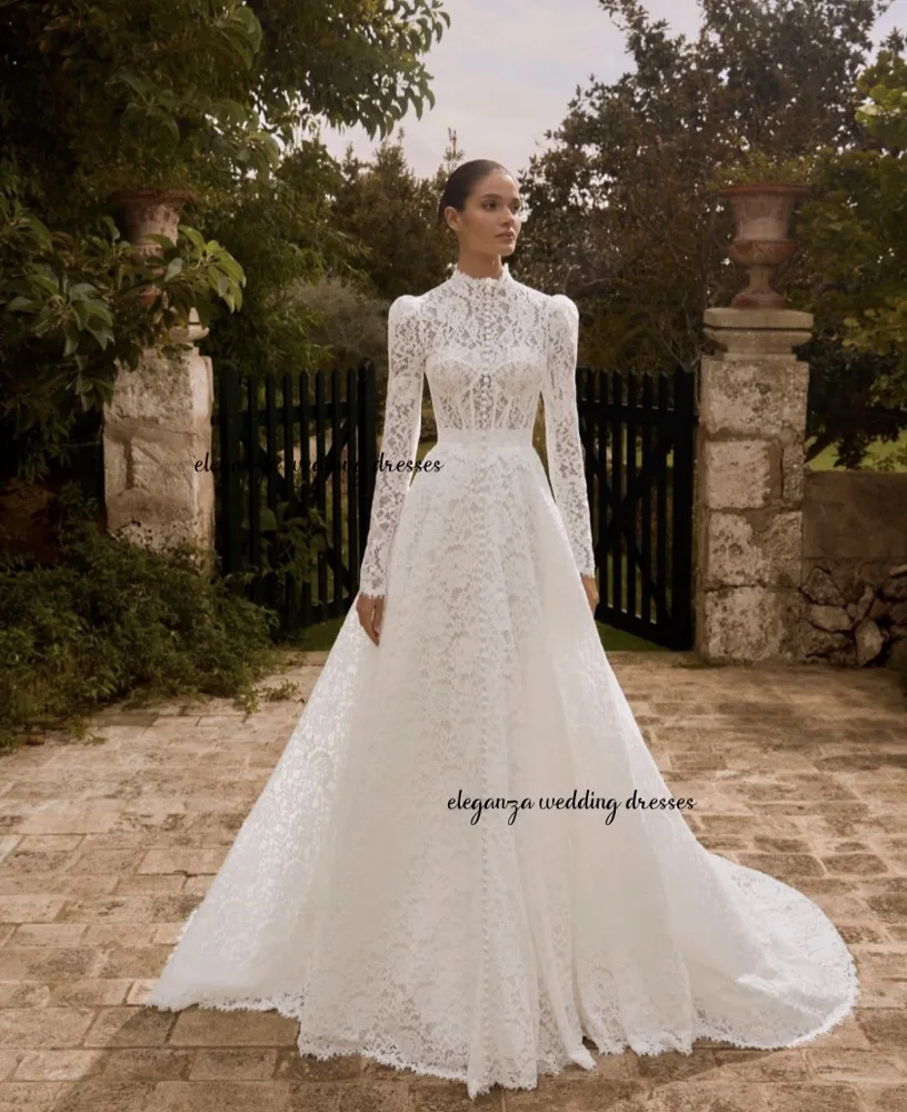 فستان زفاف عربي مخصص برقبة عالية وأكمام طويلة شفاف من خلال الدانتيل على شكل حرف A فستان زفاف سويب تراين للمرأة أماندا نوفيا