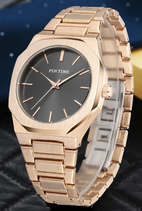 Montre à quartz étanche pour homme et femme, goujons à barre avec un motif de soleil littéral, design minimaliste, bande d'acier, nouvelle mode, 30 m, 2025