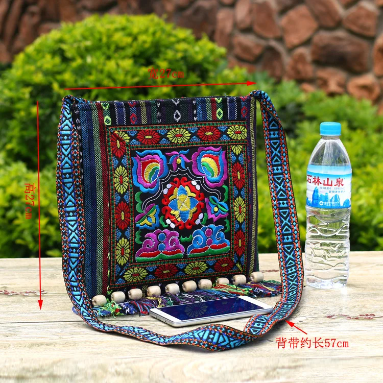 2023 new Yunnan ethnic style embroidery bag striped cloth embroidery single shoulder oblique span tassel camellia bag