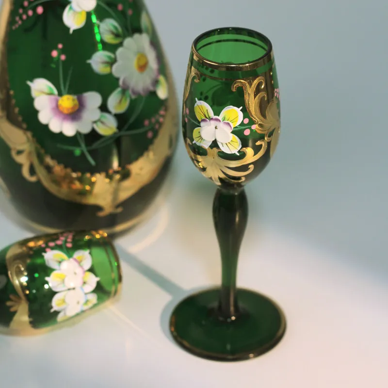 Elegant crystal champagne goblet featuring hand-painted European and Bohemian motifs in green blue purple hues embossed enamel f