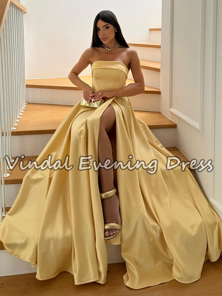 فساتين حفلة موسيقية أنيقة باللون الأصفر على شكل حرف A من Vindal بطول الأرض بدون أكمام من الساتان بدون حمالات وفتحة جانبية لحفلات الزفاف حسب الطلب