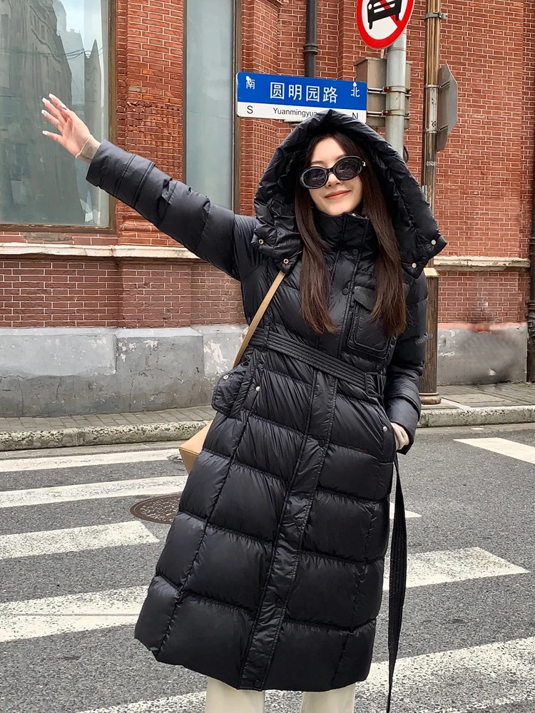 

2023 Winter Women's Hooded Long Down Jacket Long Sleeve Zipper Female Solid Color Warm Puffer Coat with Sashes