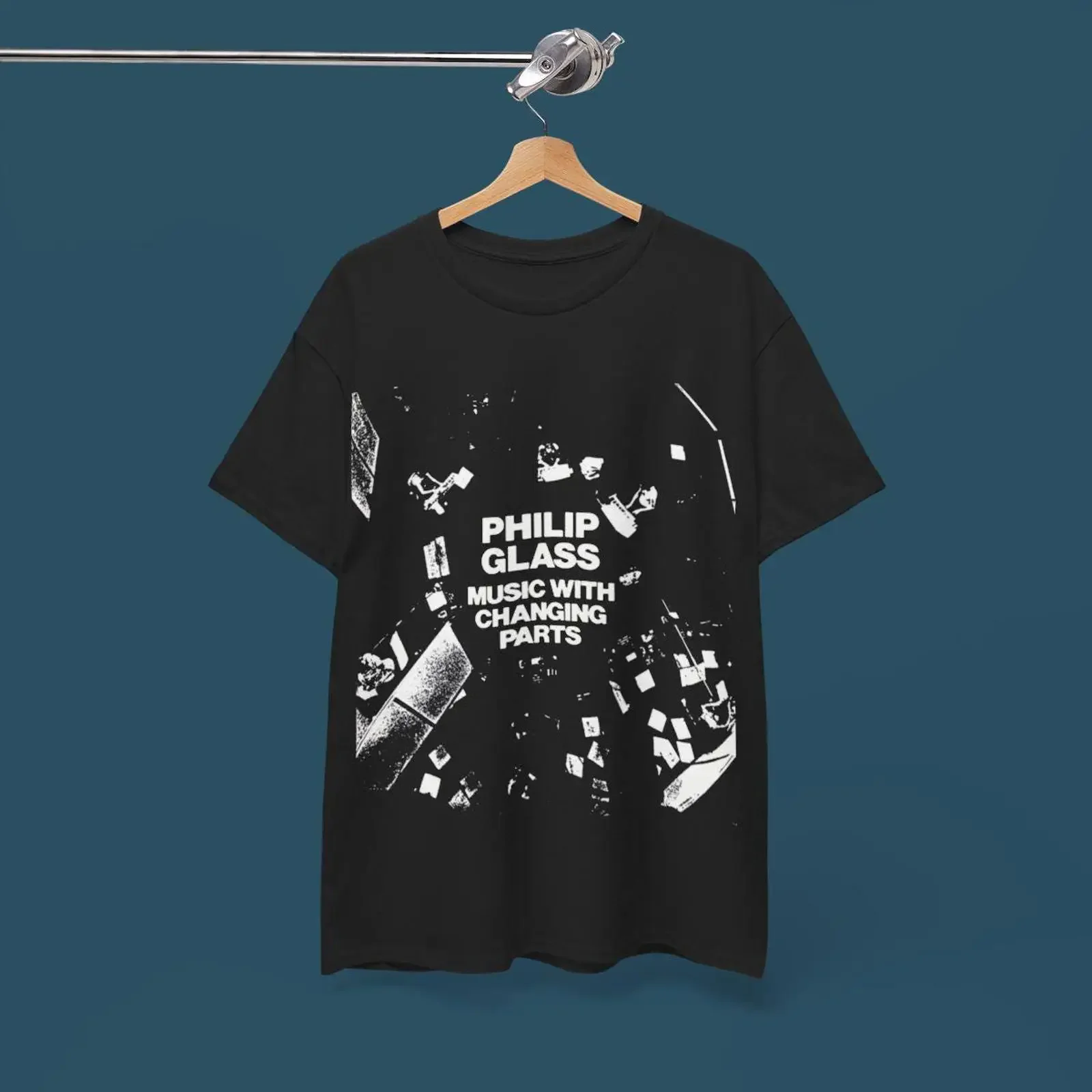 May include Black t shirt with a white graphic print of the album cover for Music Changing Parts by Philip Glass vintage Soft