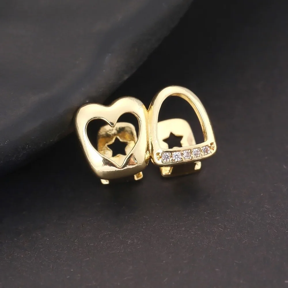 Nuevo Color dorado Hip Hop Diente Grillz circonita brillante joyería de dientes de cobre doble corazón hueco Dental Grillz mujeres