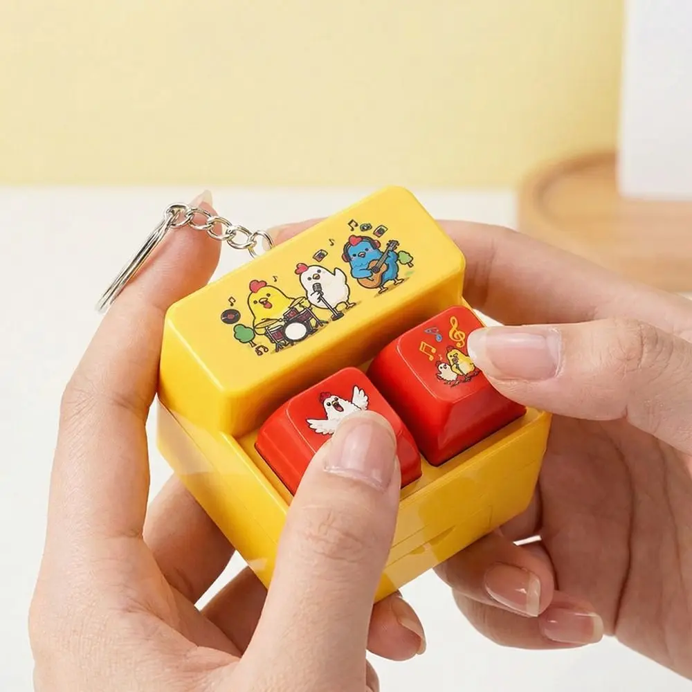 Chaveiro Interativo de Plástico com Teclado de Botões para Jogos, Luz LED e Ativação por Voz - Portátil e com Desenho Animado
