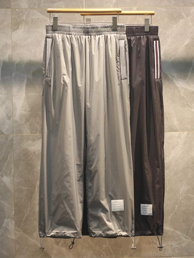 

Высококачественные мужские повседневные нейлоновые брюки прямого кроя однотонного цвета с узором K для весны-осени 2026 года в городском стиле