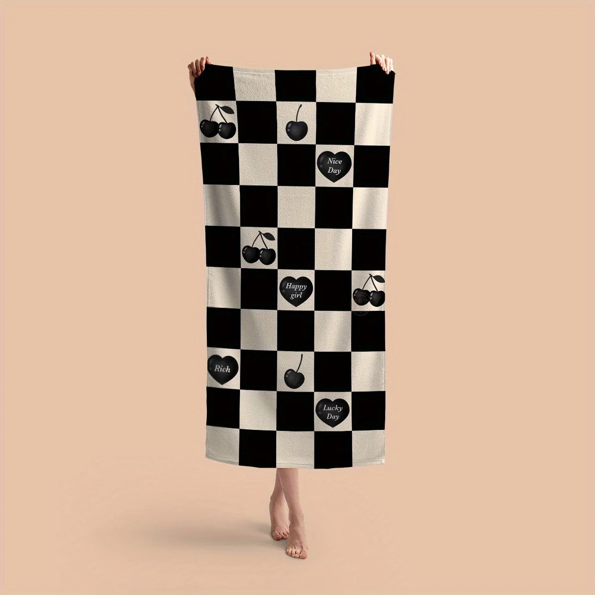 

The black and white checkered cherry beach towel is a must-have for beach vacations. Spread it out and relax instantly